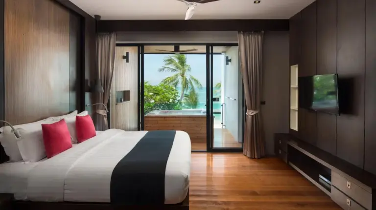 a house with a large glass door with a patio at Pavilion Pool Residence Samui - SHA Extra Plus in Lamai
