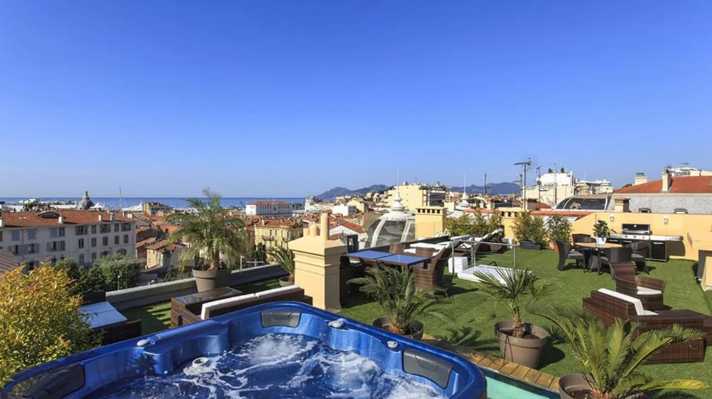 a hot tub on the roof of a building at Residence du Louvre - Apartments - Prime location Palais & Croisette - Luxury Stay by LRA Cannes in Cannes