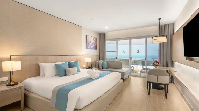 a balcony with a view of the ocean at Royal Cliff Grand Hotel Pattaya in Pattaya South