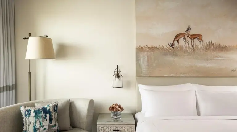 a hotel room with a bed and a couch at Saadiyat Rotana Resort and Villas in Abu Dhabi