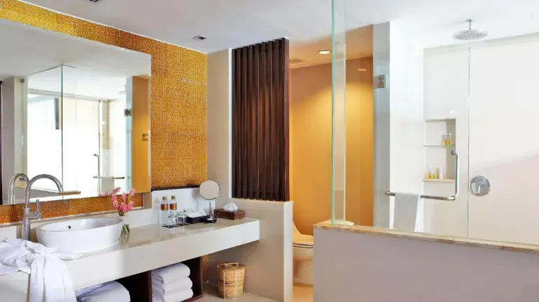 a bathroom with a sink and a large mirror at Sareeraya Villas & Suites in Chaweng