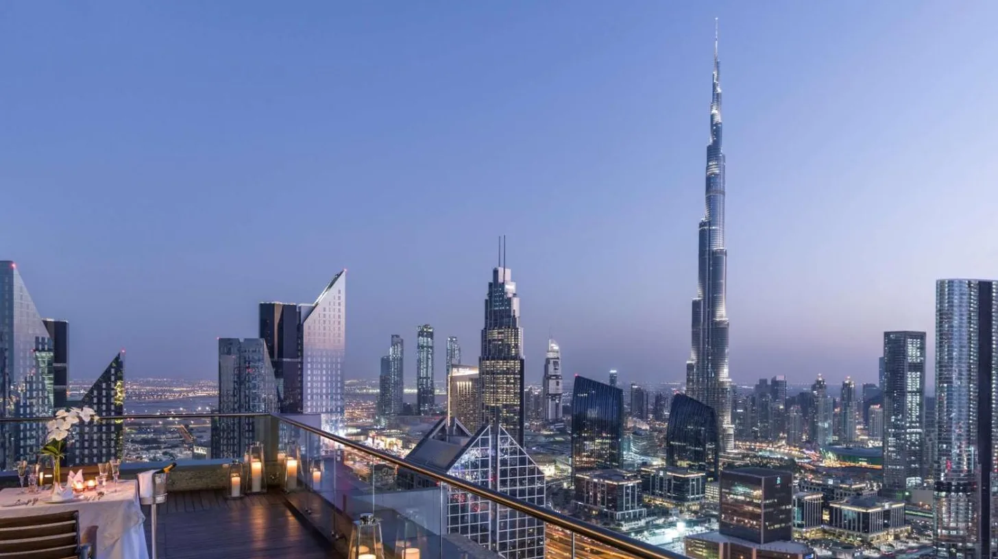 a view of a city skyline at night at Shangri-La Dubai in Dubai