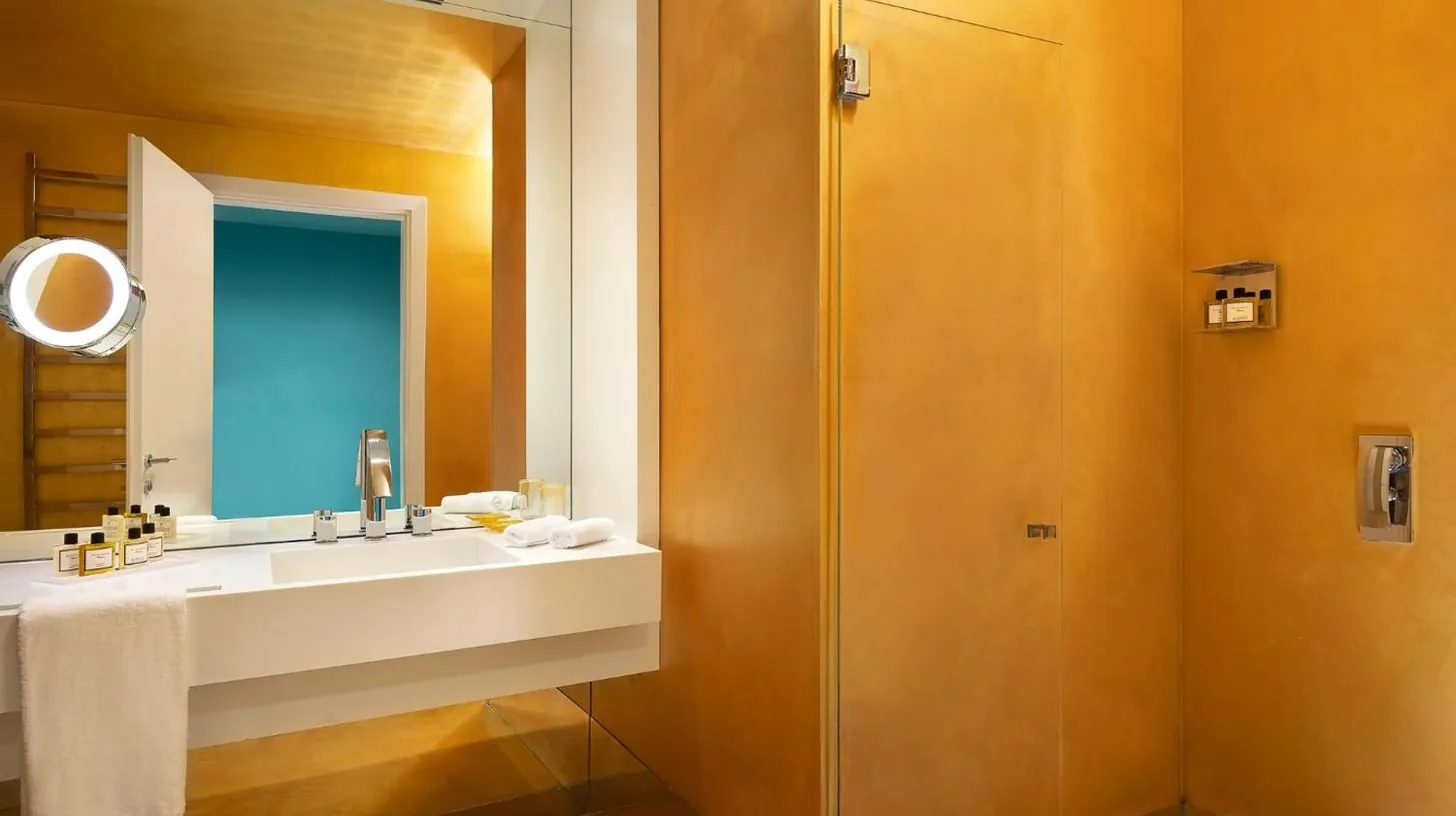 a bathroom with a sink and a shower at Sina Centurion Palace in Venice