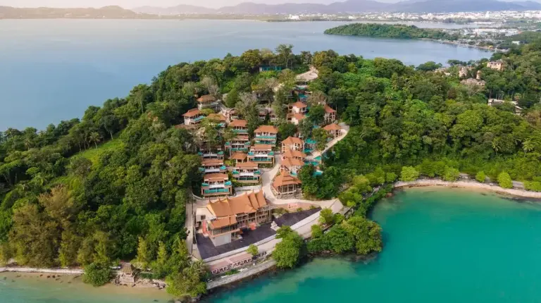 an aerial view of a resort on an island in the water at SINAE Phuket Luxury Hotel in Phuket Town