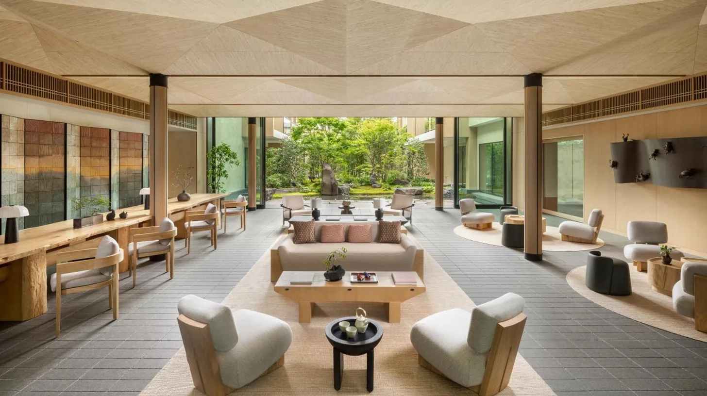 a lobby of a hotel with couches and chairs at Six Senses Kyoto in Kyoto