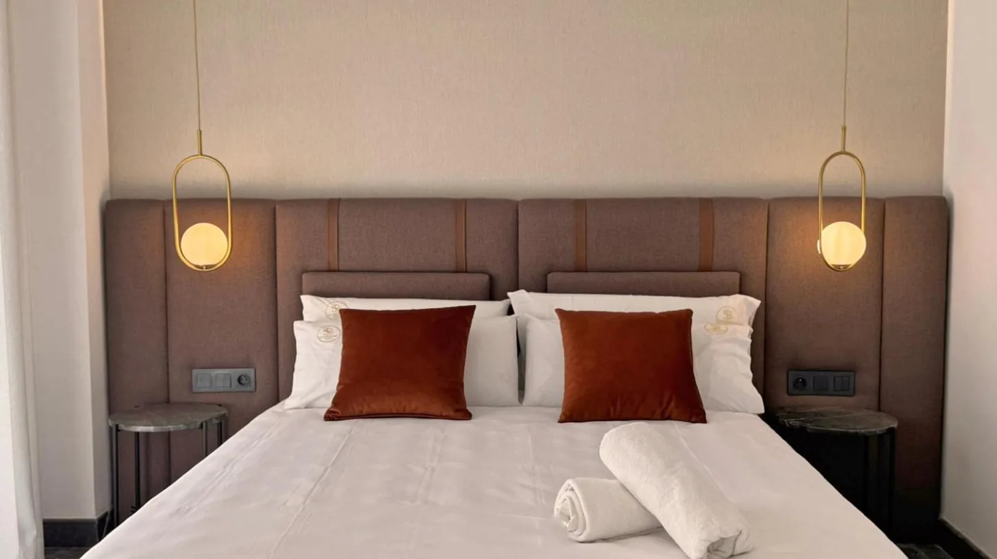 a bedroom with a large white bed with two pillows at Soho Boutique Casablanca in Casablanca