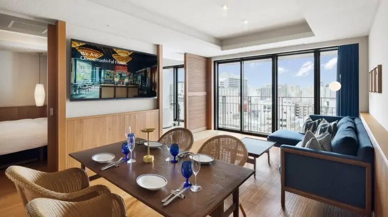 a living room with a table and a couch at Southwest Grand Hotel in Naha