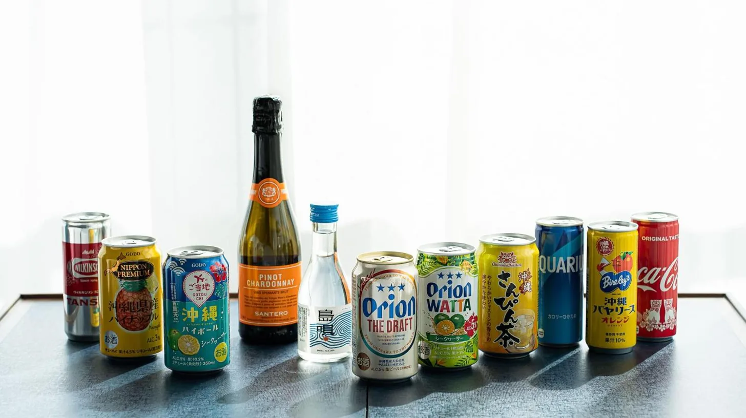a group of cans and bottles of beer on a counter at Southwest Grand Hotel in Naha