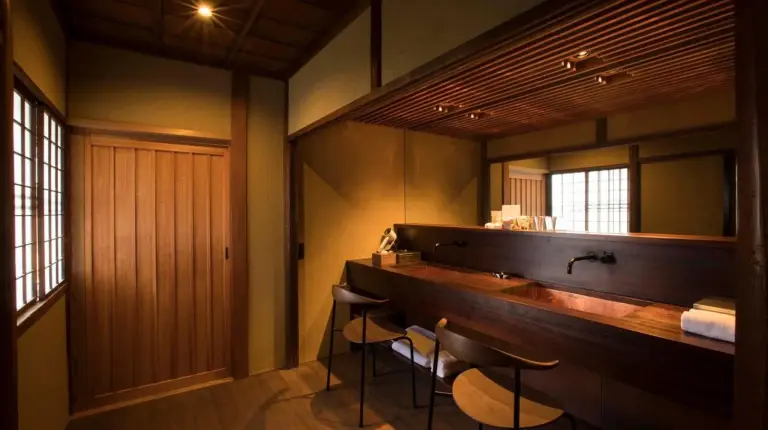 a bathroom with a wooden tub and a shower at Sowaka in Kyoto