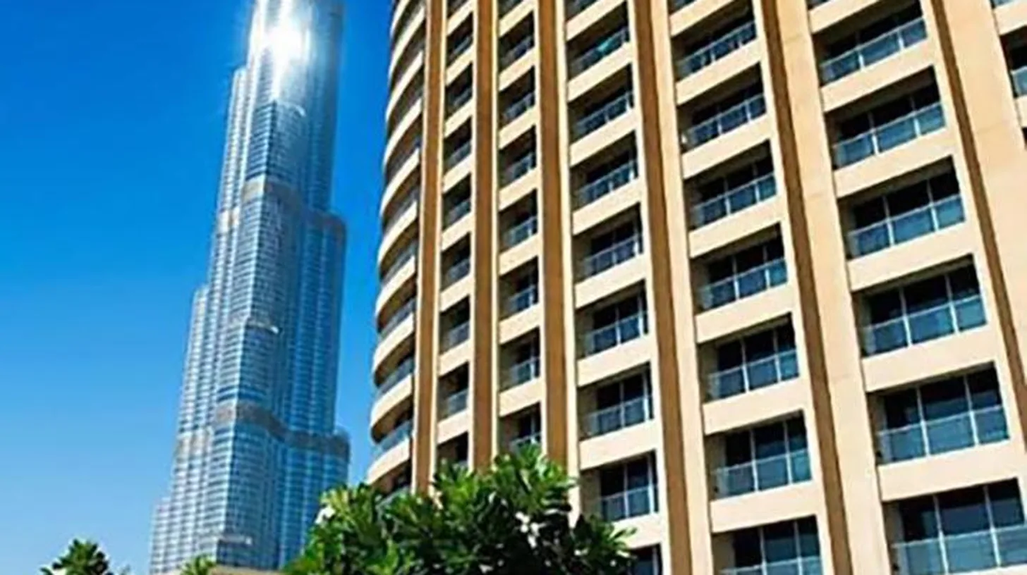 a view of the burj khalifa from the courtyard of a building at Suitestay Address Dubai Mall Residence in Dubai