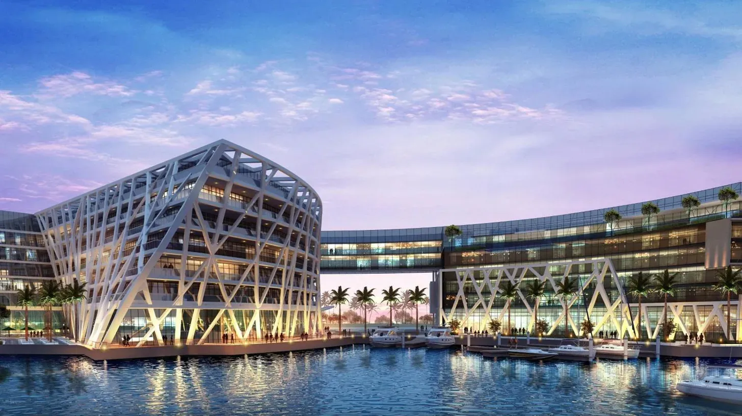 a rendering of a large building with water in front at The Abu Dhabi EDITION in Abu Dhabi