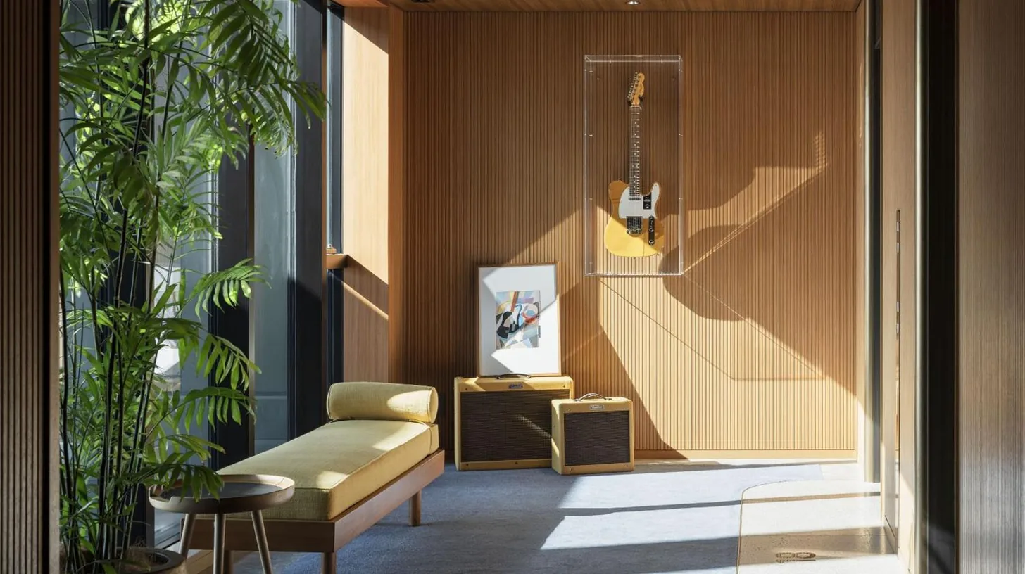 a living room with a guitar on the wall at THE AOYAMA GRAND HOTEL in Tokyo