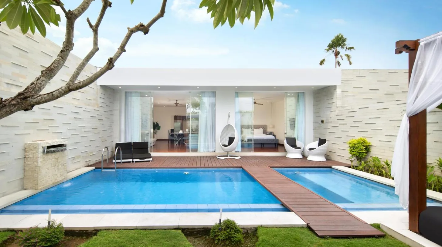 a swimming pool in the backyard of a house at The Daha Luxury Villas in Seminyak