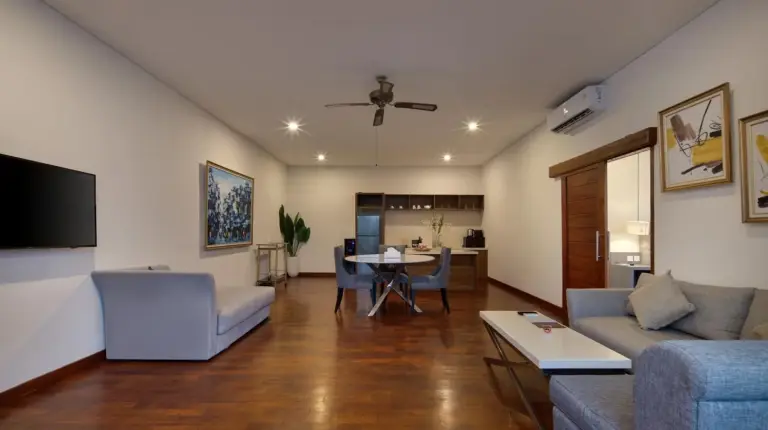 a living room with a couch and a table at The Daha Luxury Villas in Seminyak