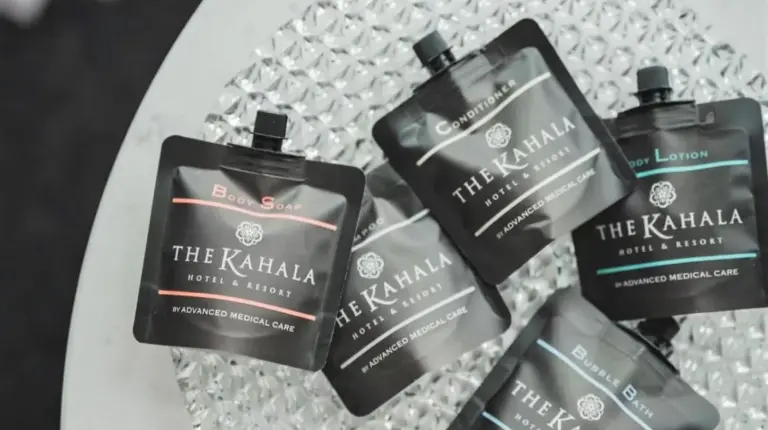 a group of four bottles of soap sitting on a table at The Kahala Hotel & Resort Yokohama in Yokohama