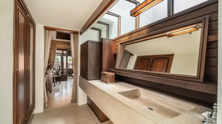 a bathroom with a sink and a mirror at The Lamai Samui in Lamai