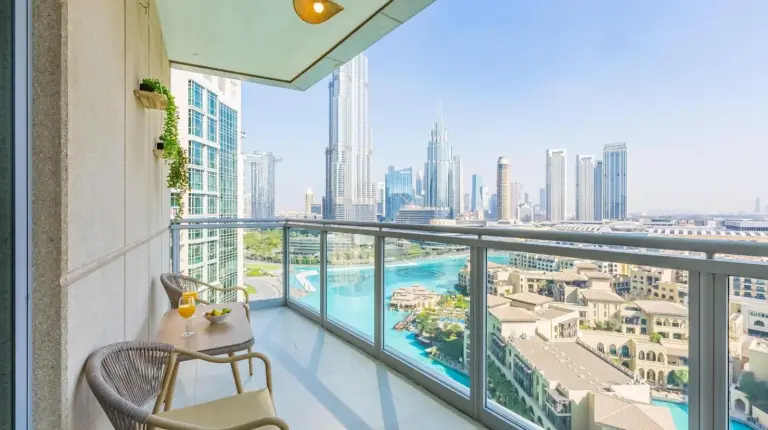 a balcony with a view of the city at the 'New York' Condo - 4BR Executive Burj Khalifa Suite in Dubai