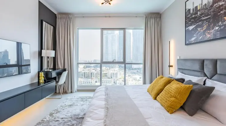 a bathroom with a shower and a toilet and a sink at the 'New York' Condo - 4BR Executive Burj Khalifa Suite in Dubai