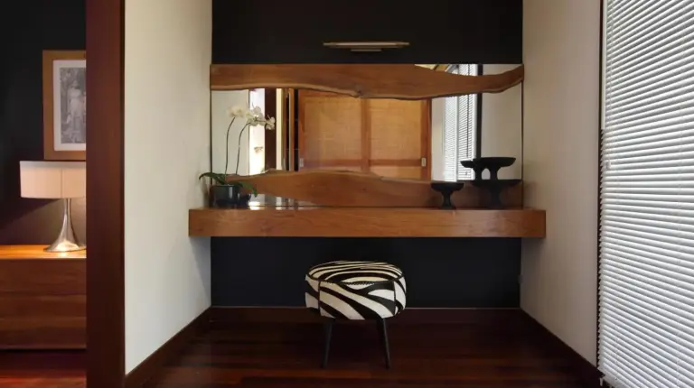 a room with a mirror and a chair in a room at The One Boutique Villa & Spa Seminyak in Seminyak