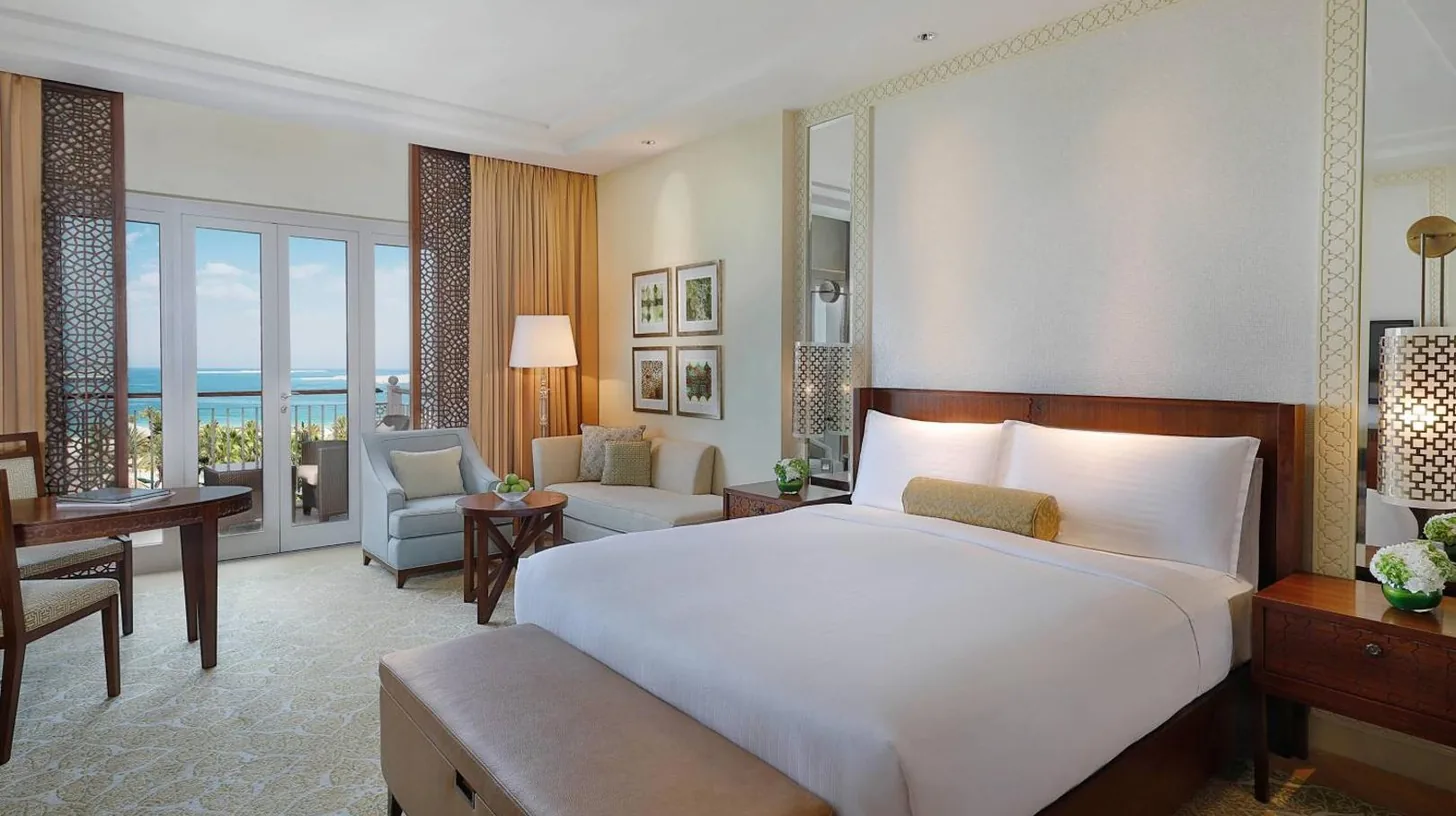 a balcony with a view of a pool at The Ritz-Carlton