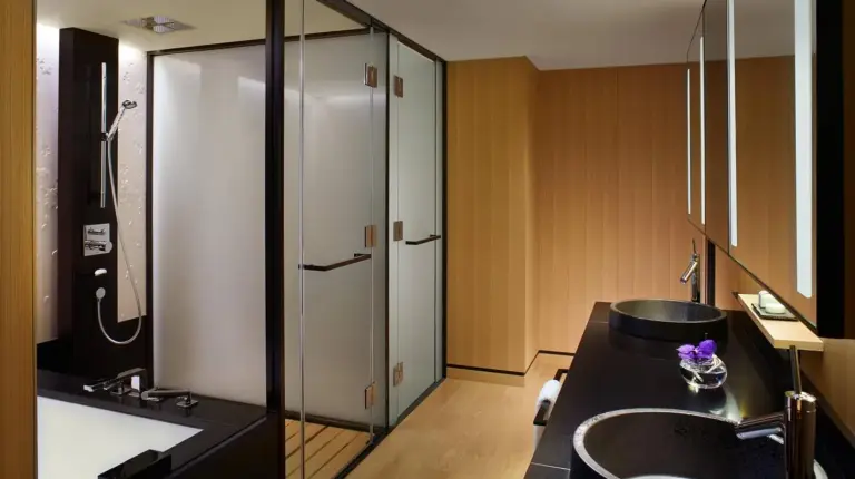 a bathroom with a black sink and a shower at The Ritz-Carlton Kyoto in Kyoto