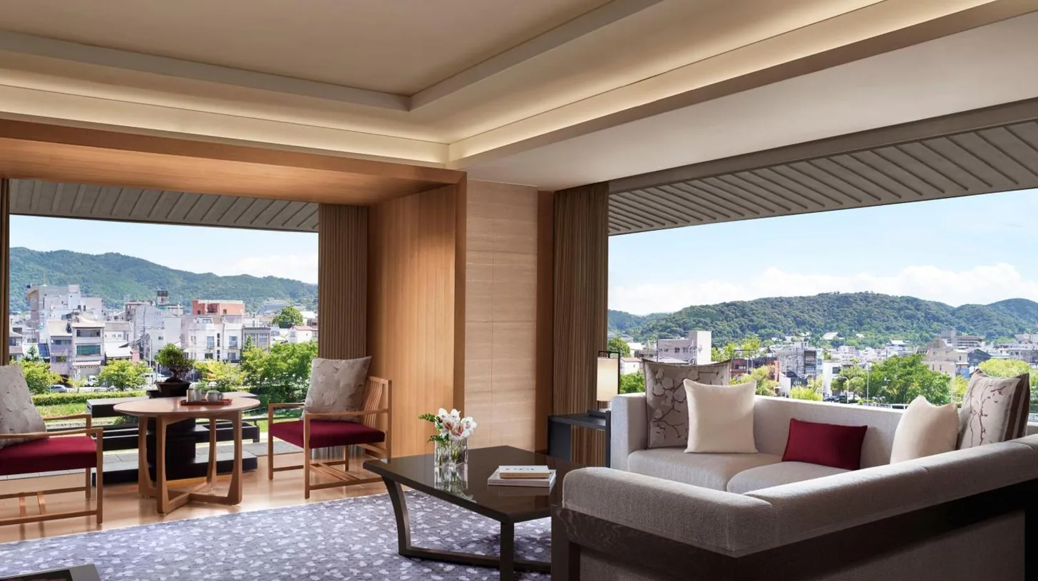a living room with a couch and a table at The Ritz-Carlton Kyoto in Kyoto