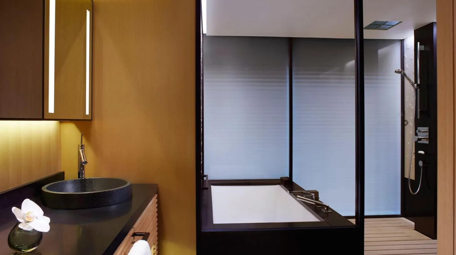 a bathroom with a sink and a shower at The Ritz-Carlton Kyoto in Kyoto