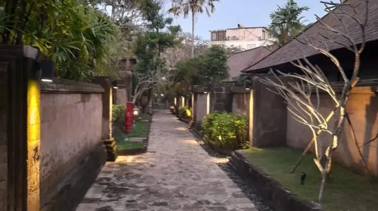 a cobblestone street in a house with a building at The Royal Beach Seminyak Bali in Seminyak