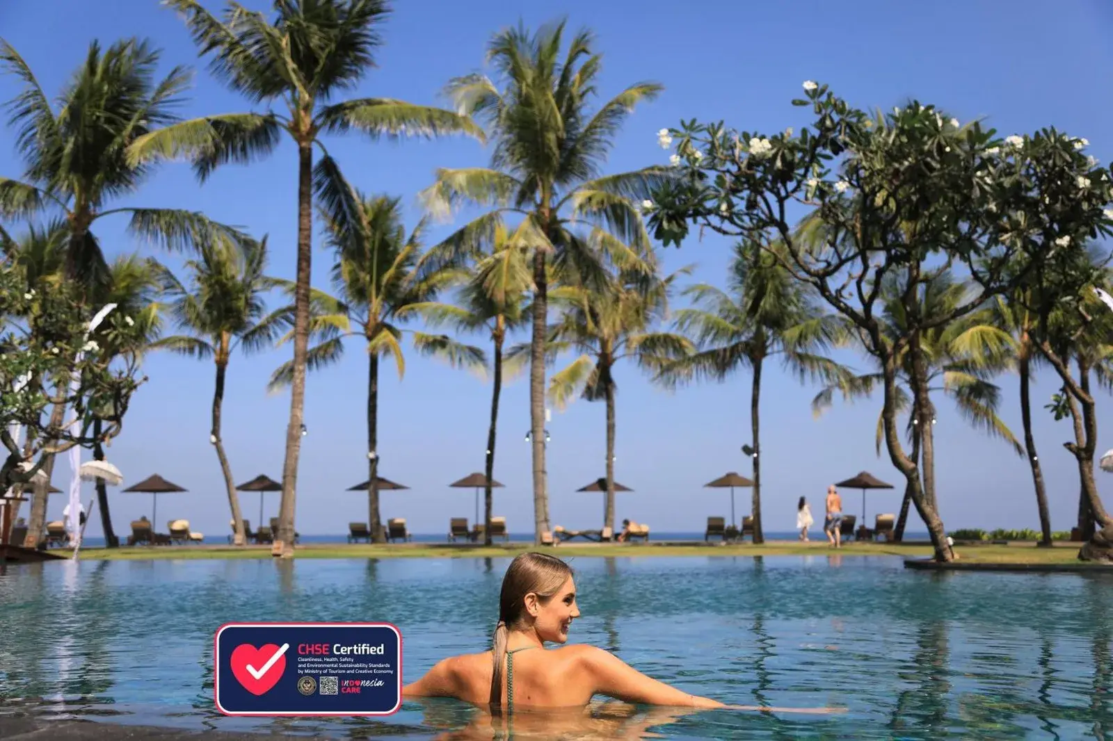 Infinity pool at The Samaya Seminyak Bali with palm trees