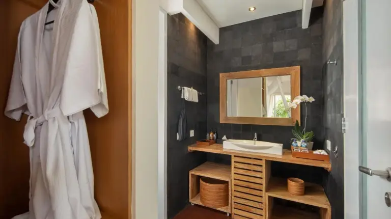a bathroom with a sink and a mirror at The Seiryu Boutique Bali Villas in Seminyak