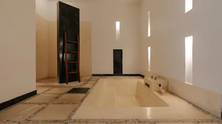 a bathroom with a tub in the middle of a room at The Seminyak Suites Private Villas in Seminyak