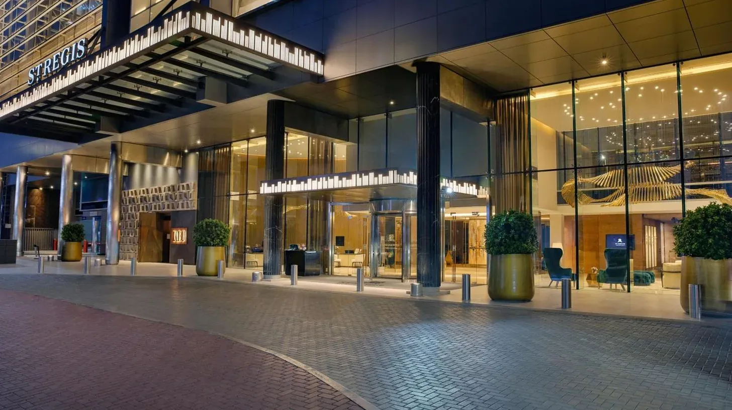 a large building with potted plants in front of it at The St. Regis Downtown Dubai in Dubai