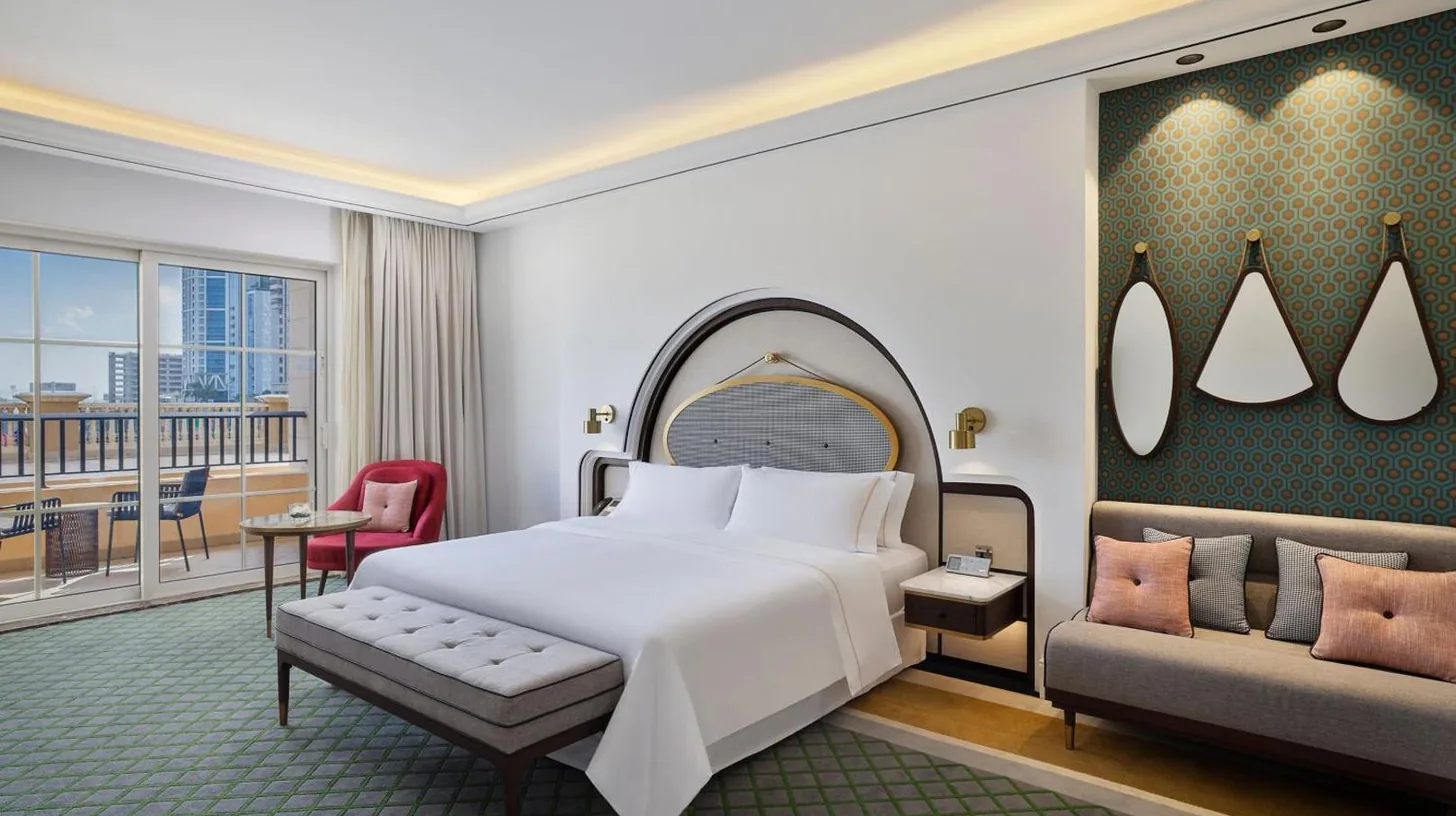 a hotel room with a bed and a couch at The Westin Dubai Mina Seyahi Beach Resort and Waterpark in Dubai