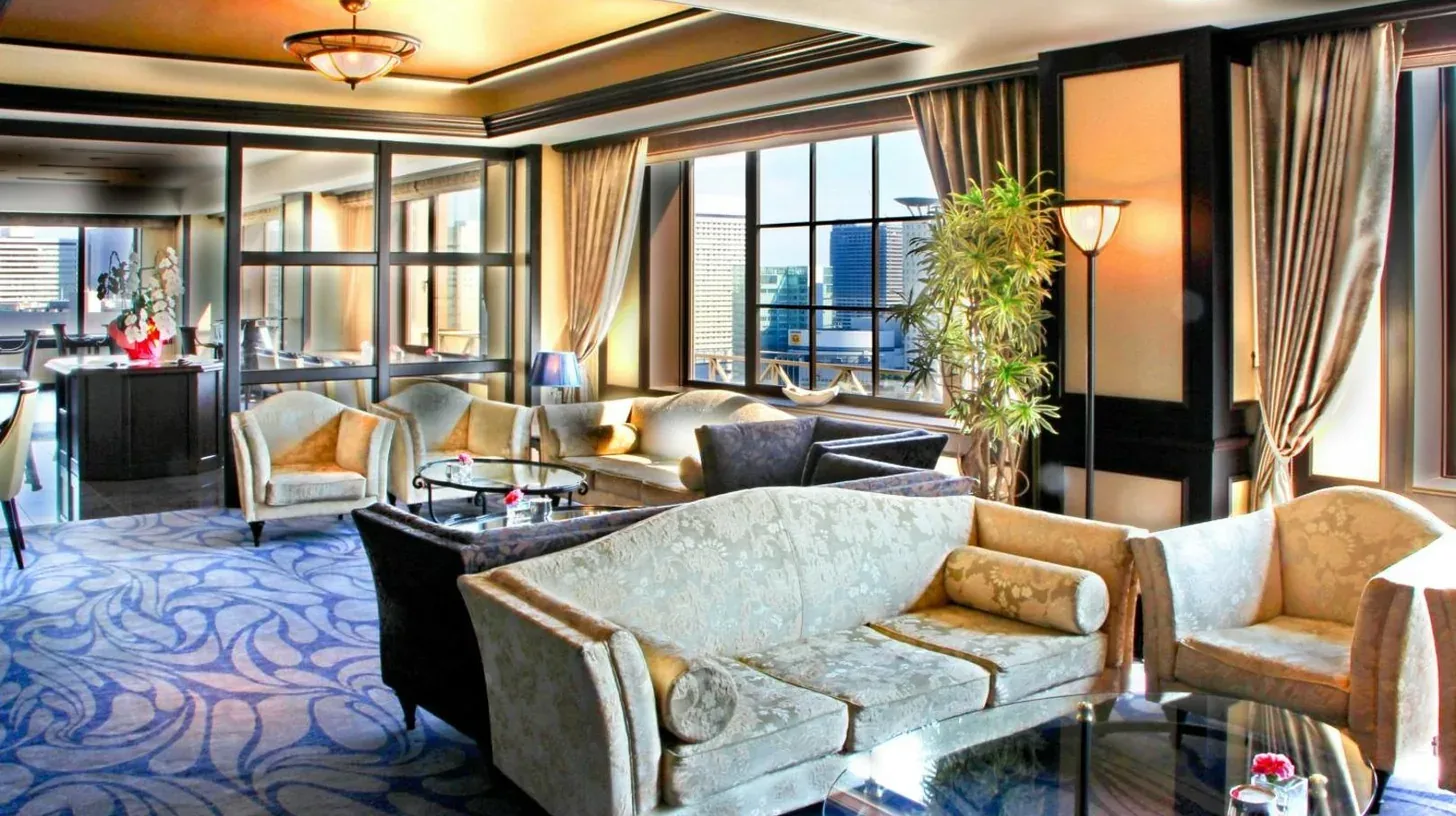a hotel room with two beds and a large window at The Westin Osaka in Osaka
