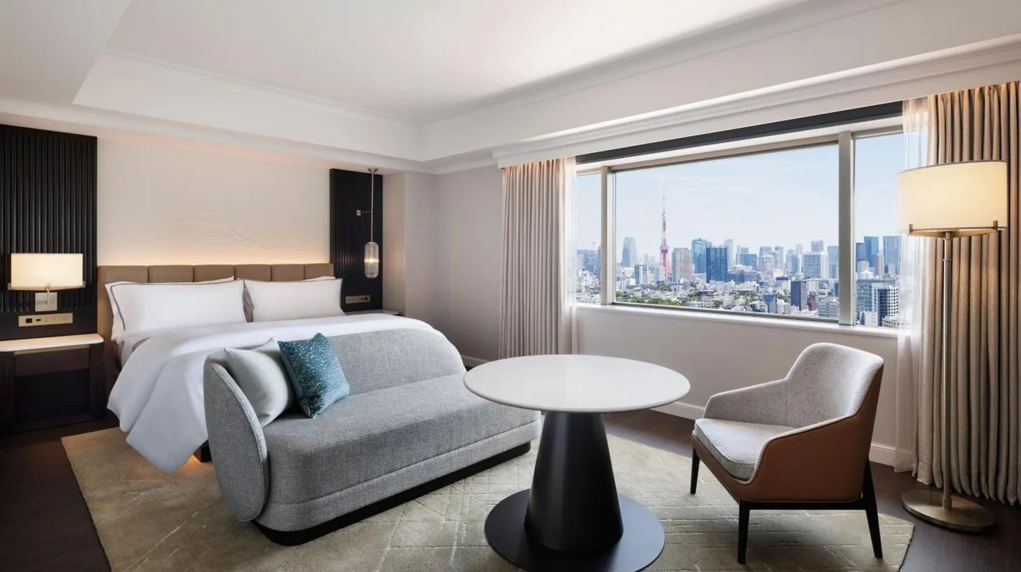 a hotel room with a bed and a table and a couch at The Westin Tokyo in Tokyo