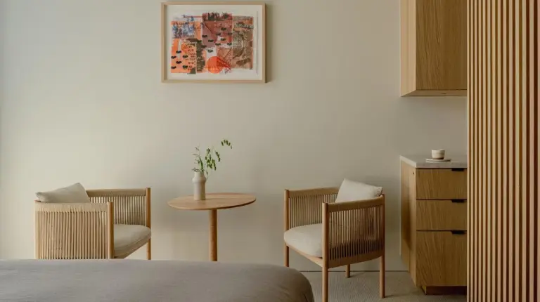 a bedroom with a table and two chairs and a table at TRUNK(HOTEL) YOYOGI PARK in Tokyo