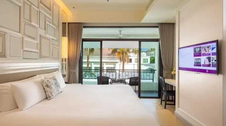 a hotel room with a bed and a television at U Sathorn Bangkok in Bangkok