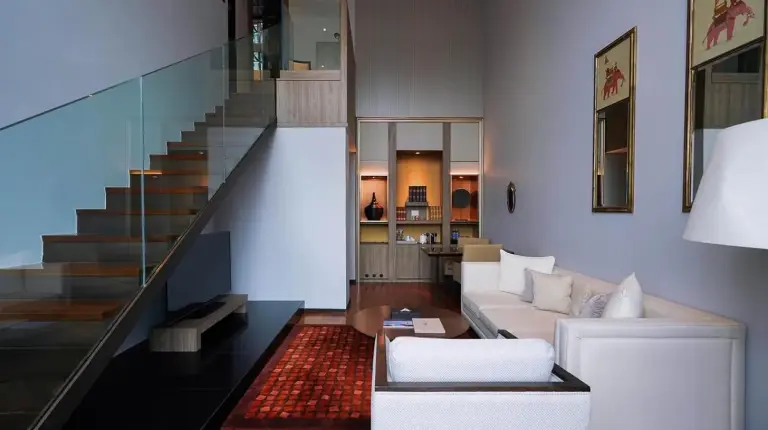 a bedroom with a large bed and a large window at VIE Hotel Bangkok - MGallery Collection in Bangkok