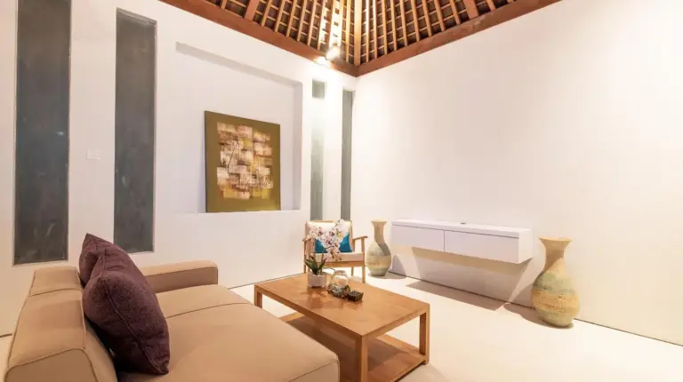 a living room with a couch and a table at Villa DeDayuh Seminyak in Seminyak