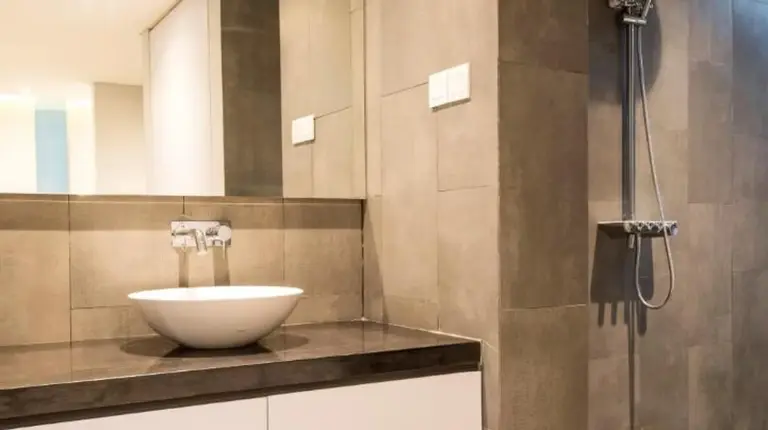 a bathroom with a sink and a shower at Villa DeDayuh Seminyak in Seminyak