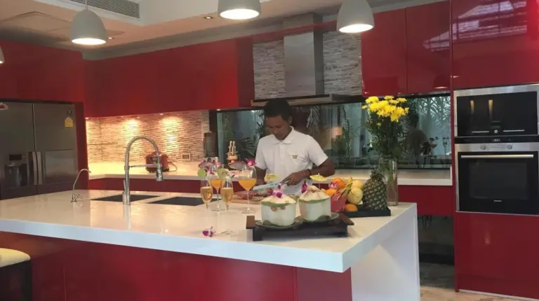 a man standing in a kitchen preparing food at Villa Julia koh Samui beach with Cook and Majordome in Lamai