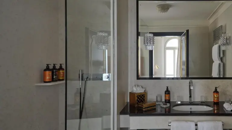 a bathroom with a shower and a sink and a mirror at Violino d'Oro Venezia in Venice