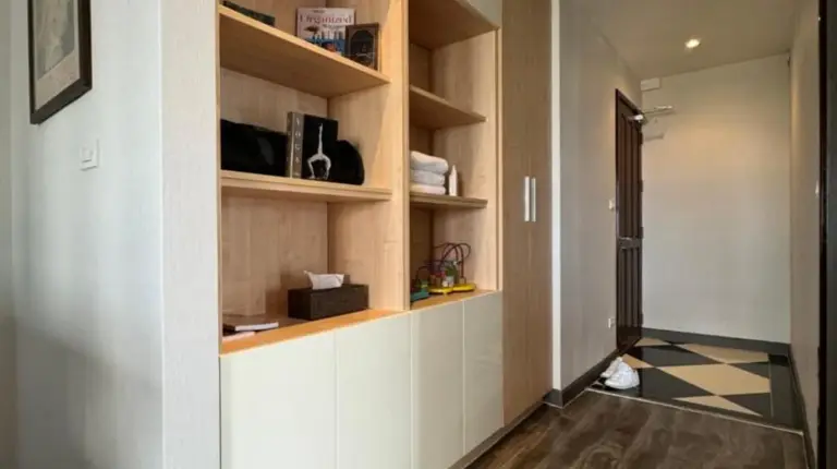 a group of glass jars on a wooden tray on a counter at W8 CONDO