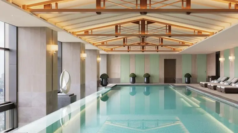 a swimming pool in a hotel lobby at Waldorf Astoria Osaka in Osaka