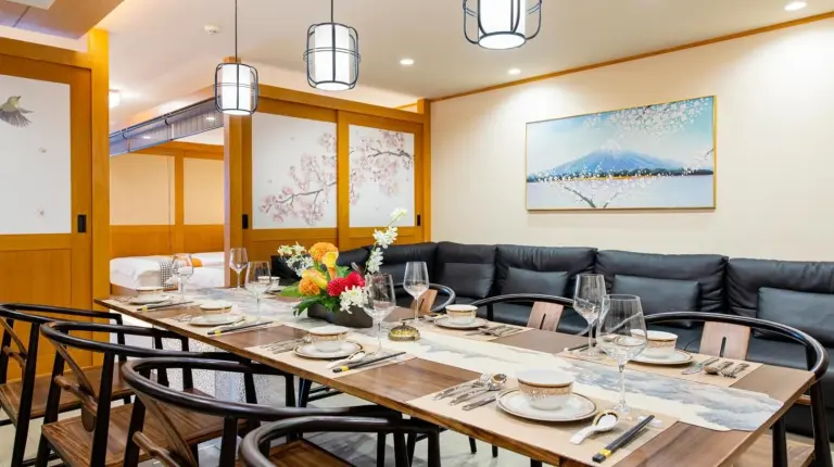 a dining room with a long table and chairs at YOKOHAMA STAY PREMIER in Yokohama