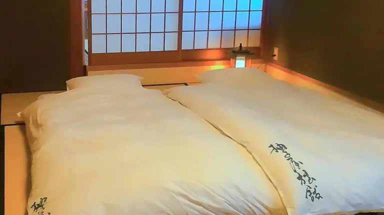 a room with three large windows in a house at Yuzuya Ryokan - Adult Only in Kyoto